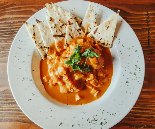 Butter chicken with naan at The Lobby Kitchen & Bar